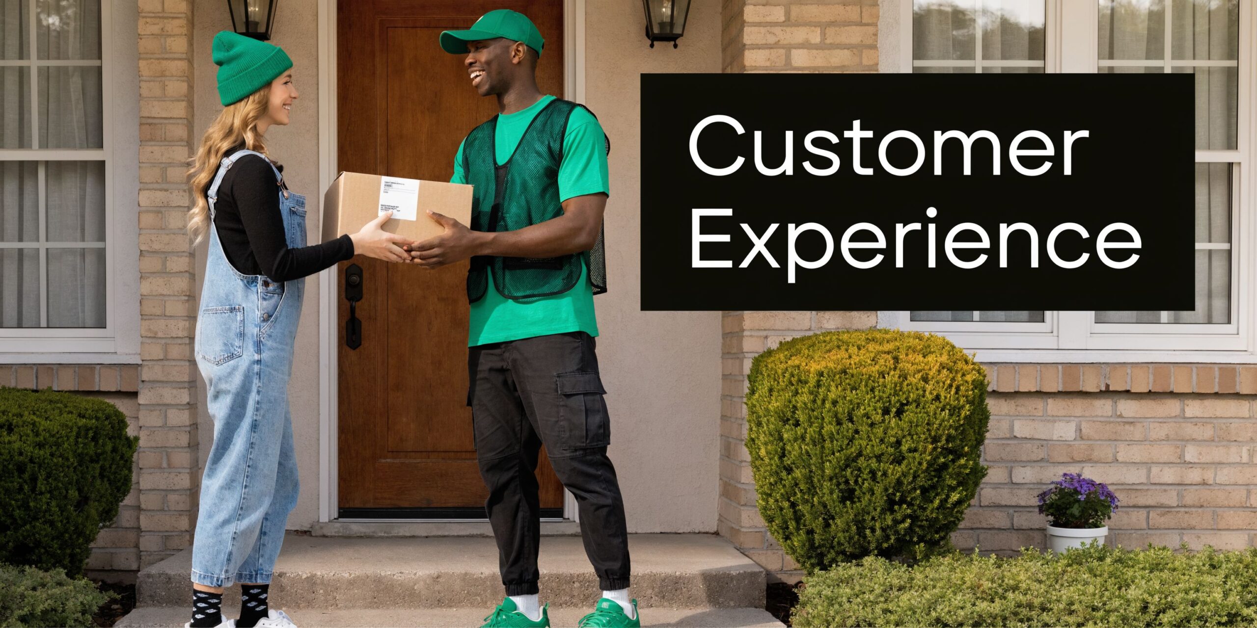A friendly delivery worker handing a package to a customer at the front door of a home.